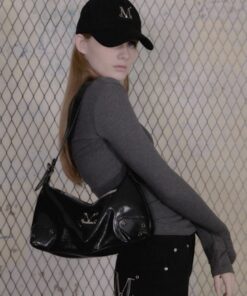 MUCENT BARB METAL LOGO 2-WAY EYELET CROSS BAG UNISEX